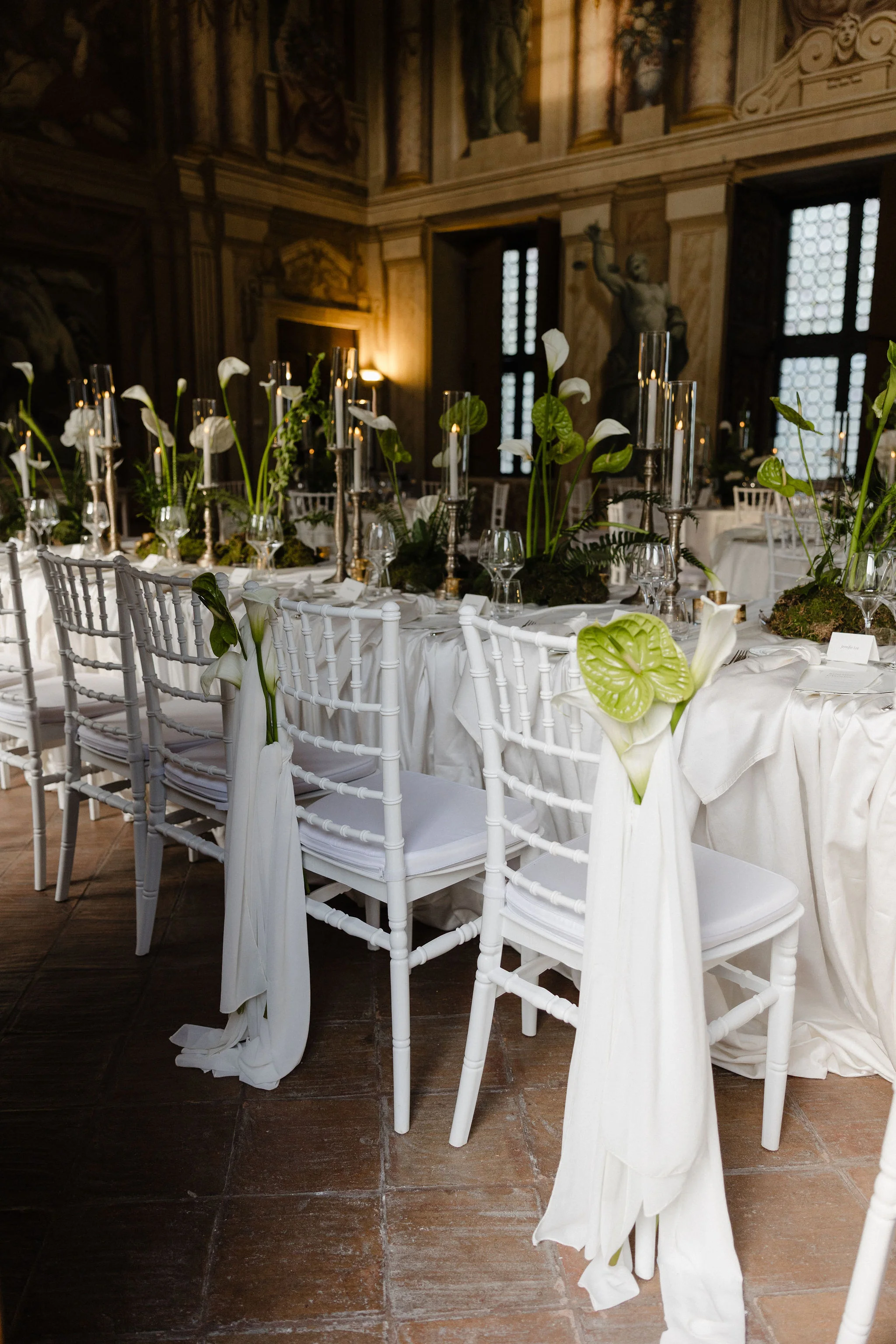 Chairs and reception tables in an ornate room