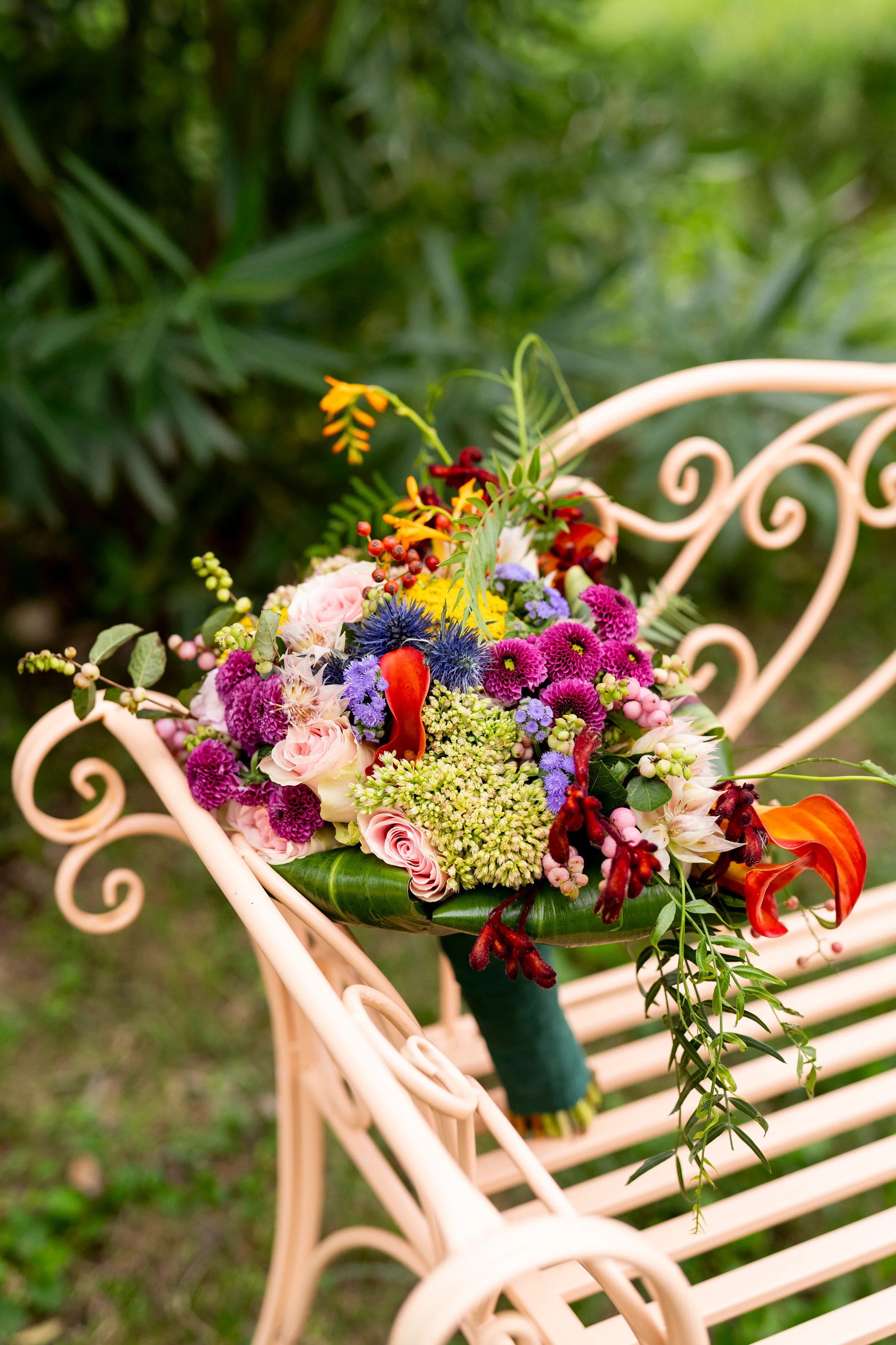Colourful bouquet on a garden chair