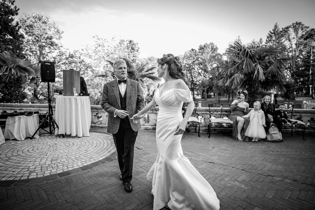 Black-and-white photograph of a couple walking outdoors