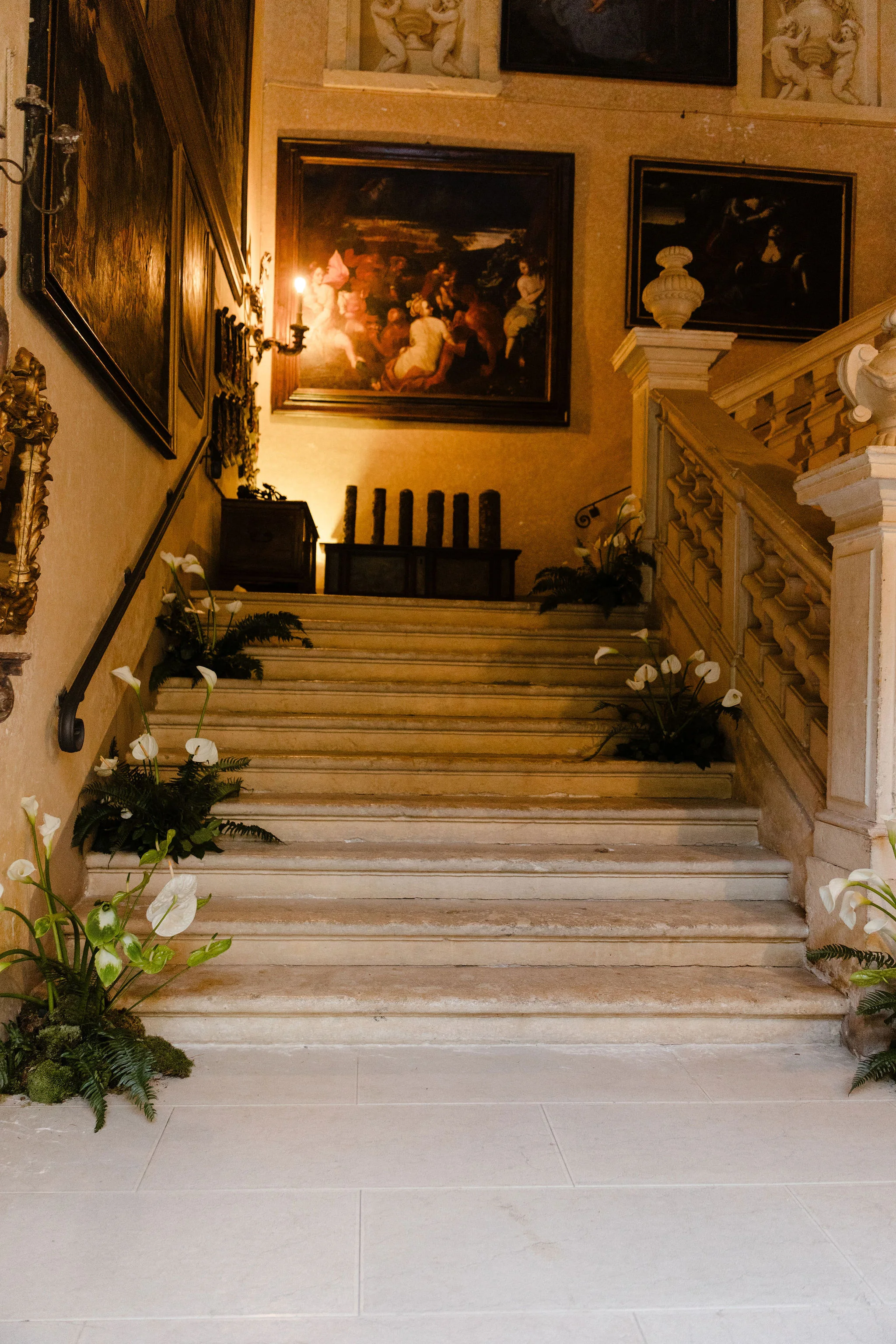 Bride standing on a grand indoor staircase