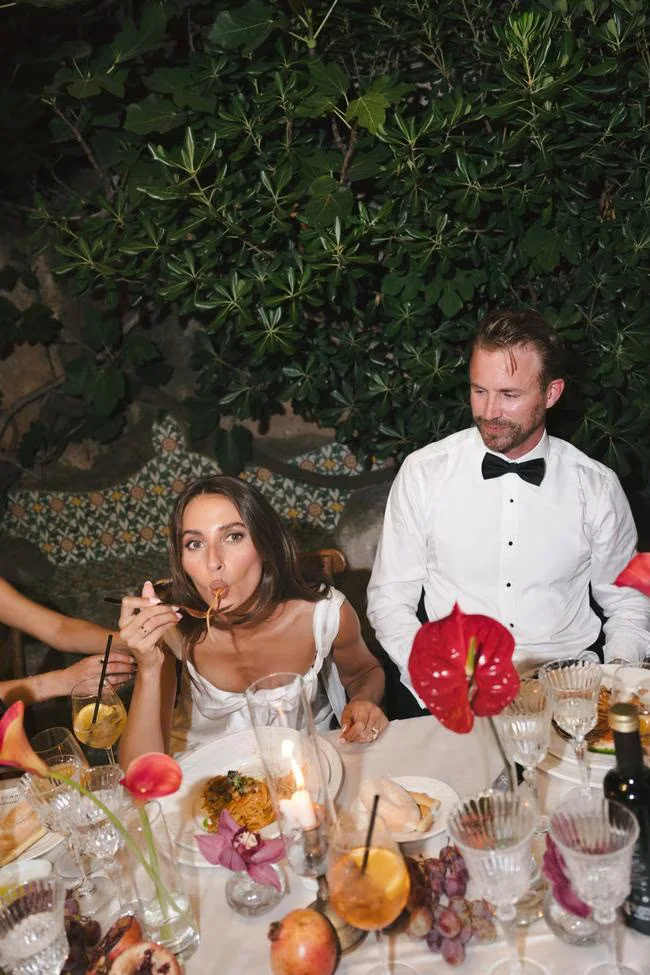 Bride and groom seated at the wedding table