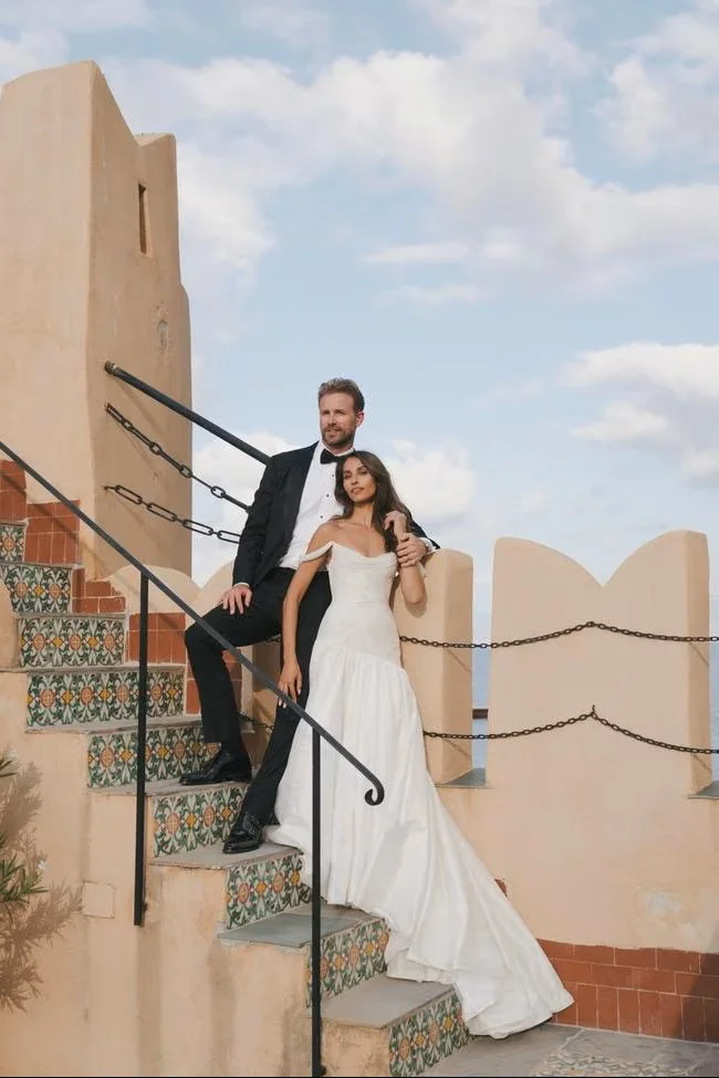 Bride and groom on a castle staircase