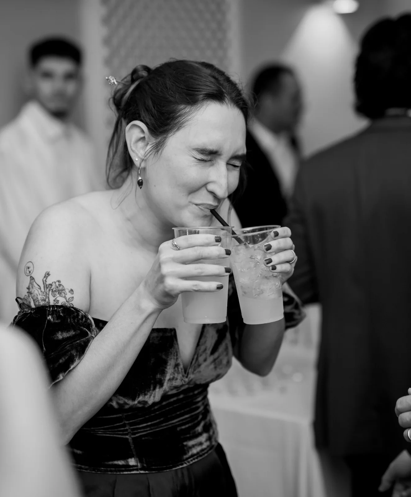 Black-and-white close portrait at a reception table