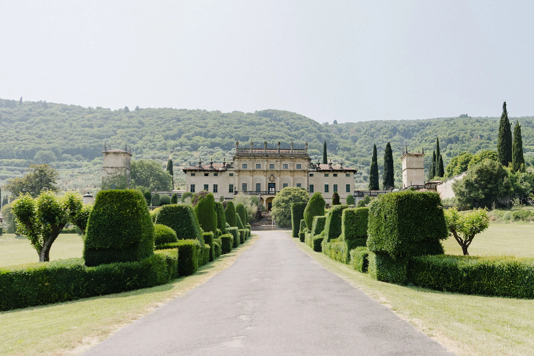 Tree-lined approach to a villa