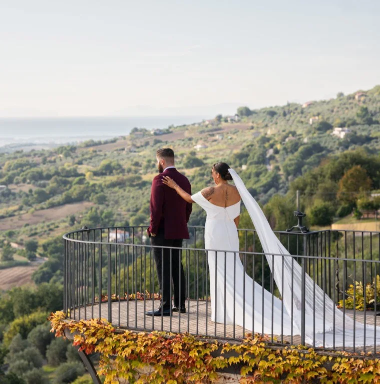 Bride and groom on a hillside terrace