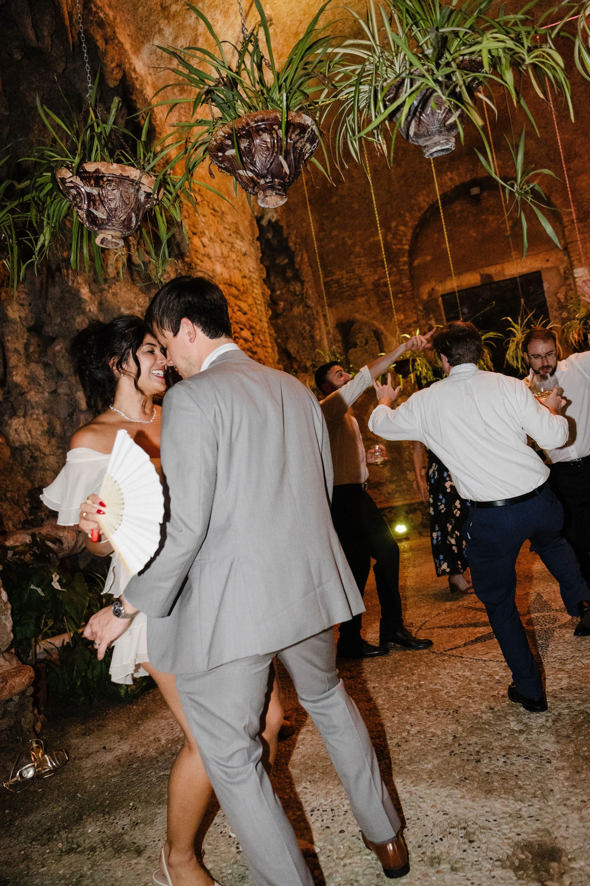 Bride and groom kissing on the dance floor
