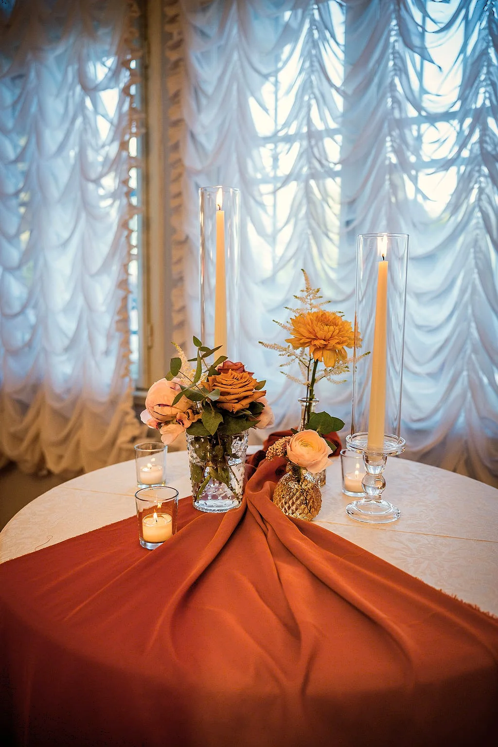 Decorated reception table beside a tall window