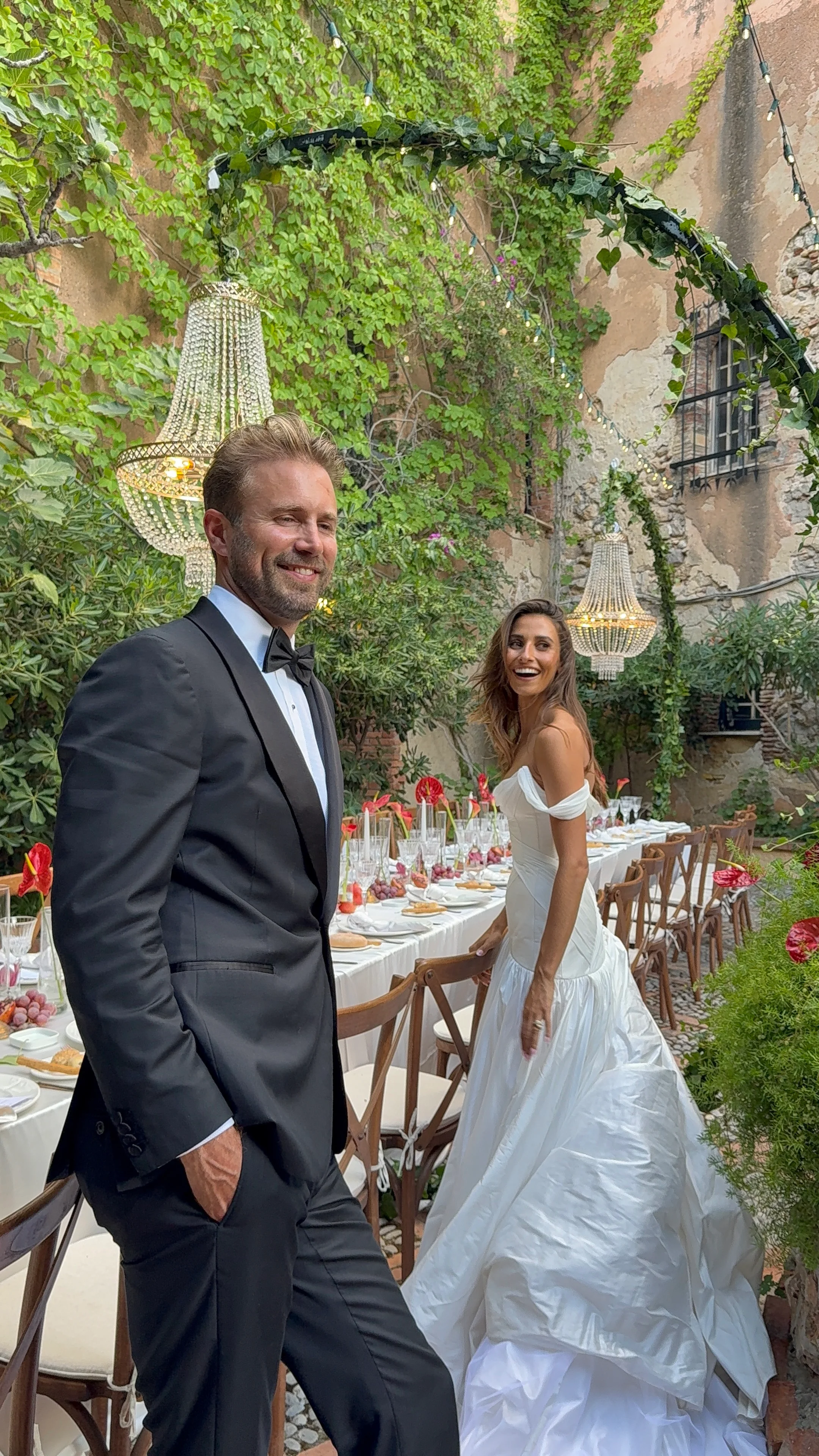 Groom and bride in a courtyard garden