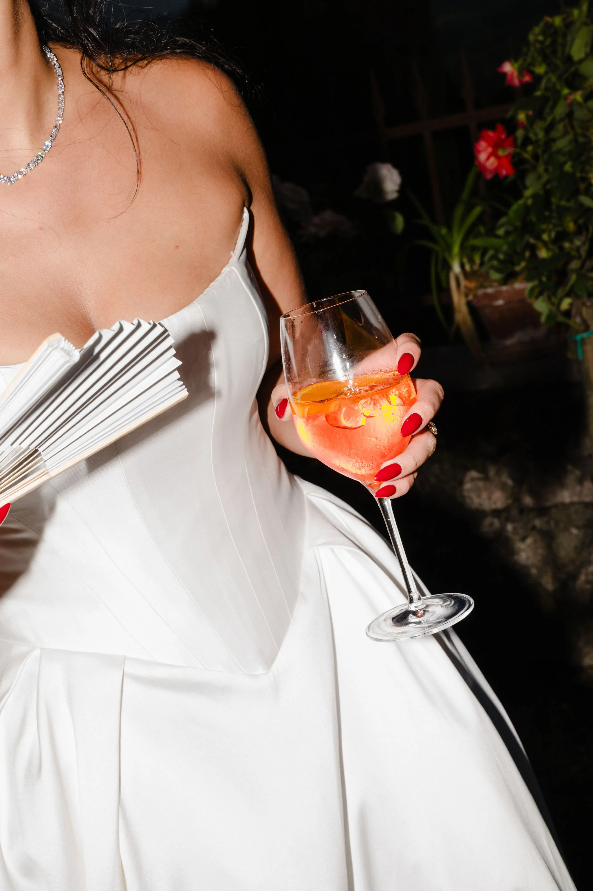 Close detail of drinks and wedding attire