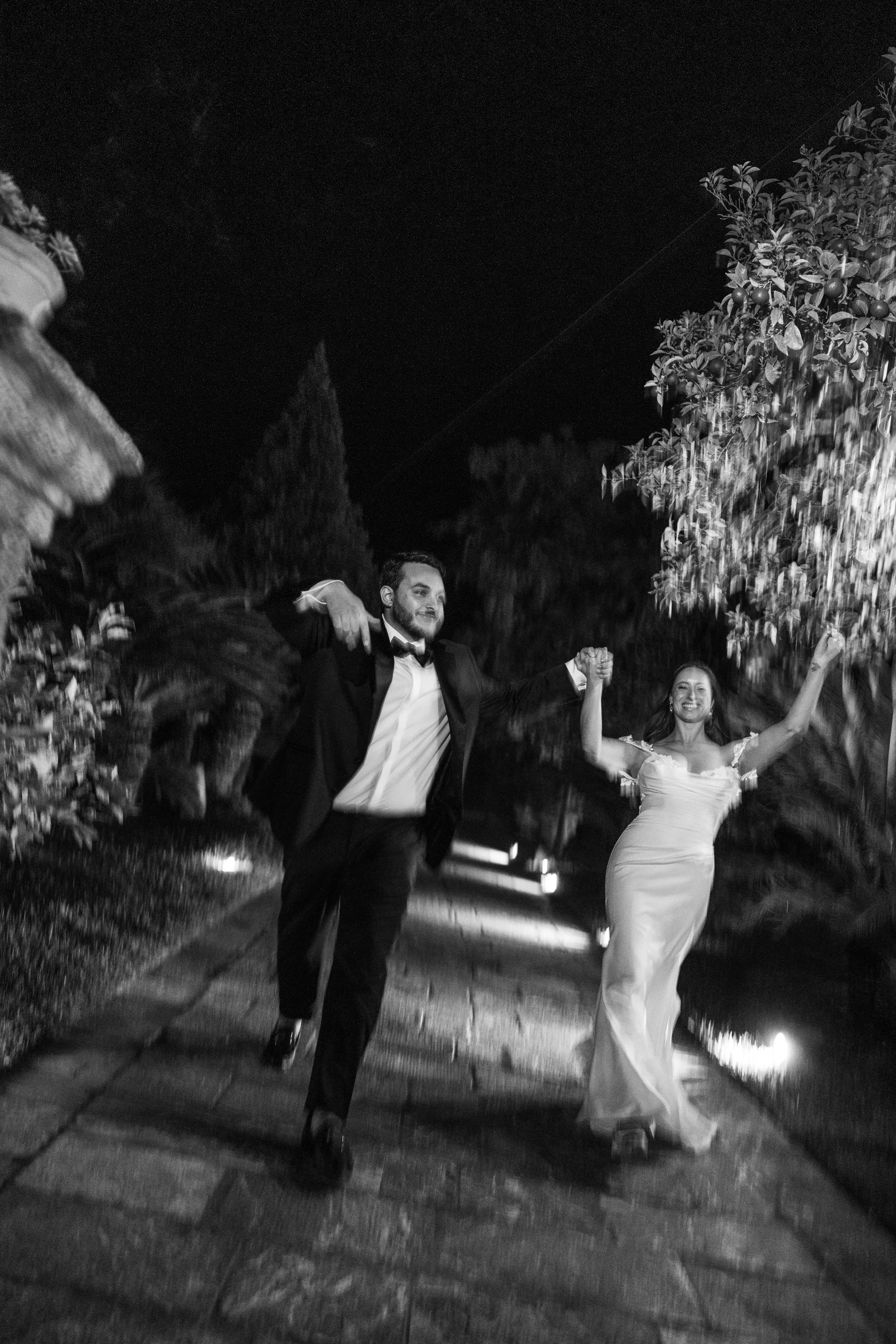 Black-and-white couple dancing at night