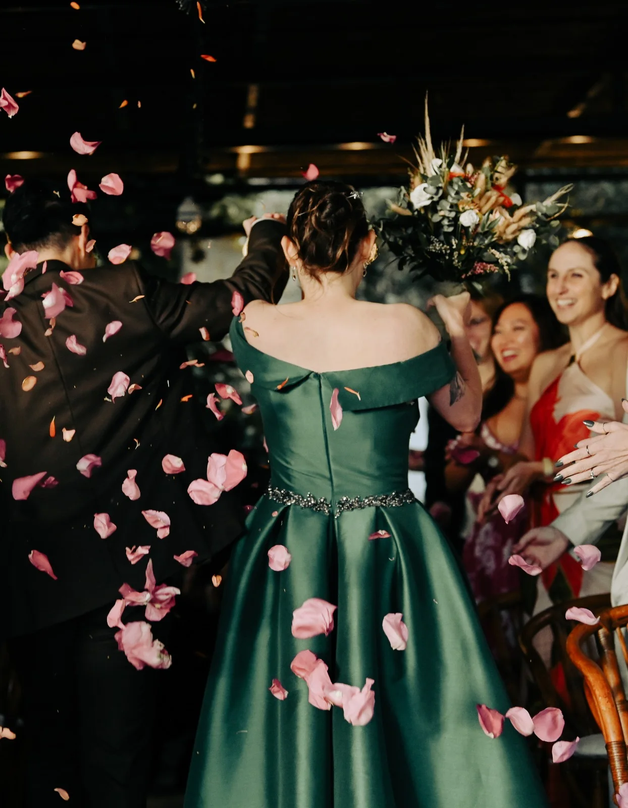 Couple walking through falling confetti