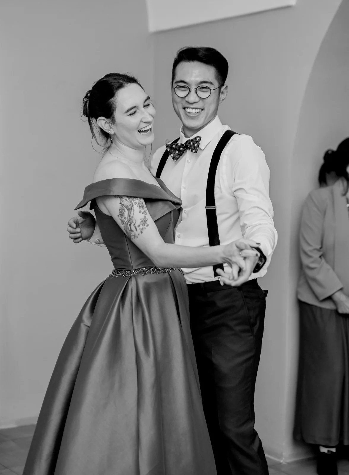 Black-and-white portrait of a couple embracing