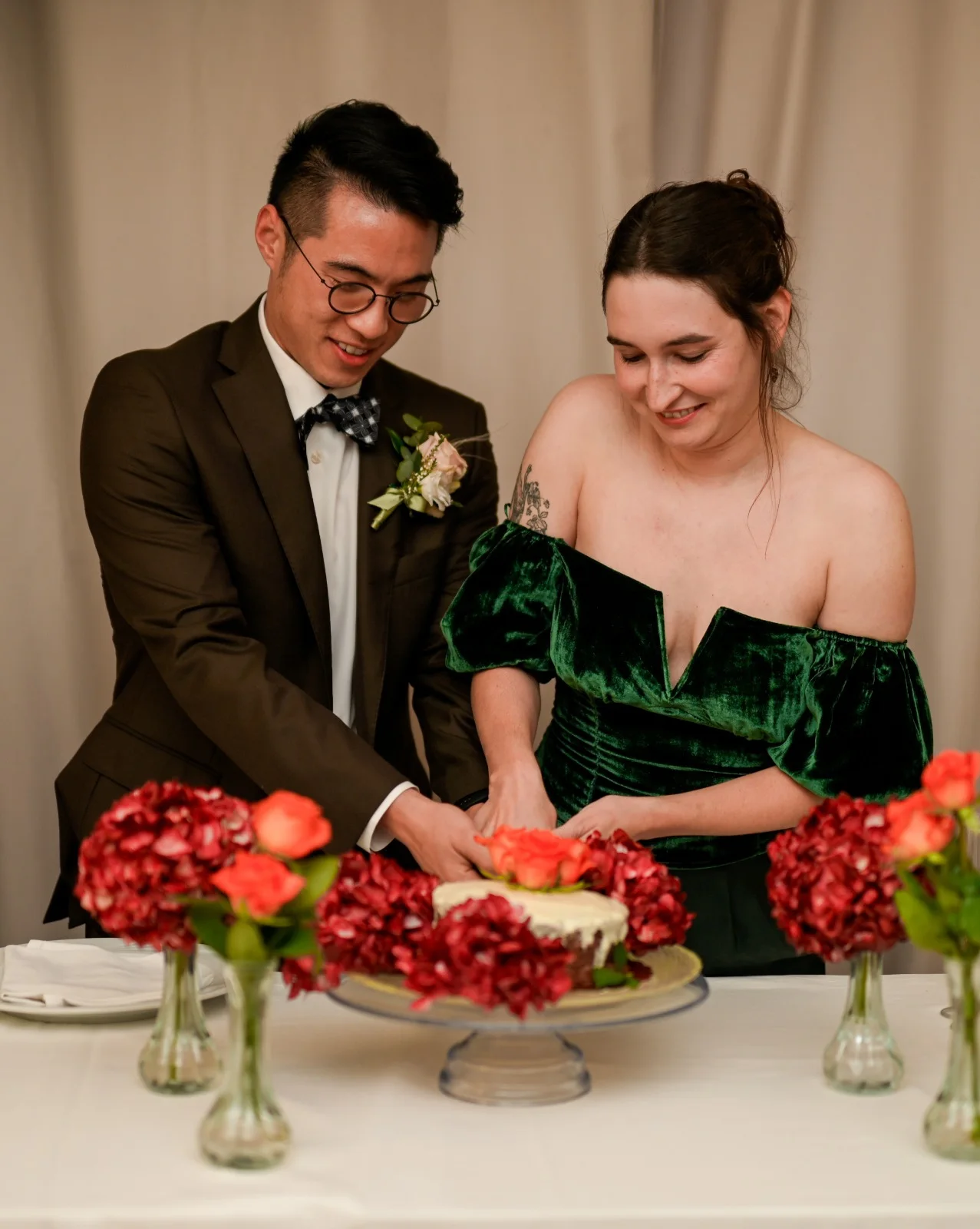 Couple cutting their wedding cake