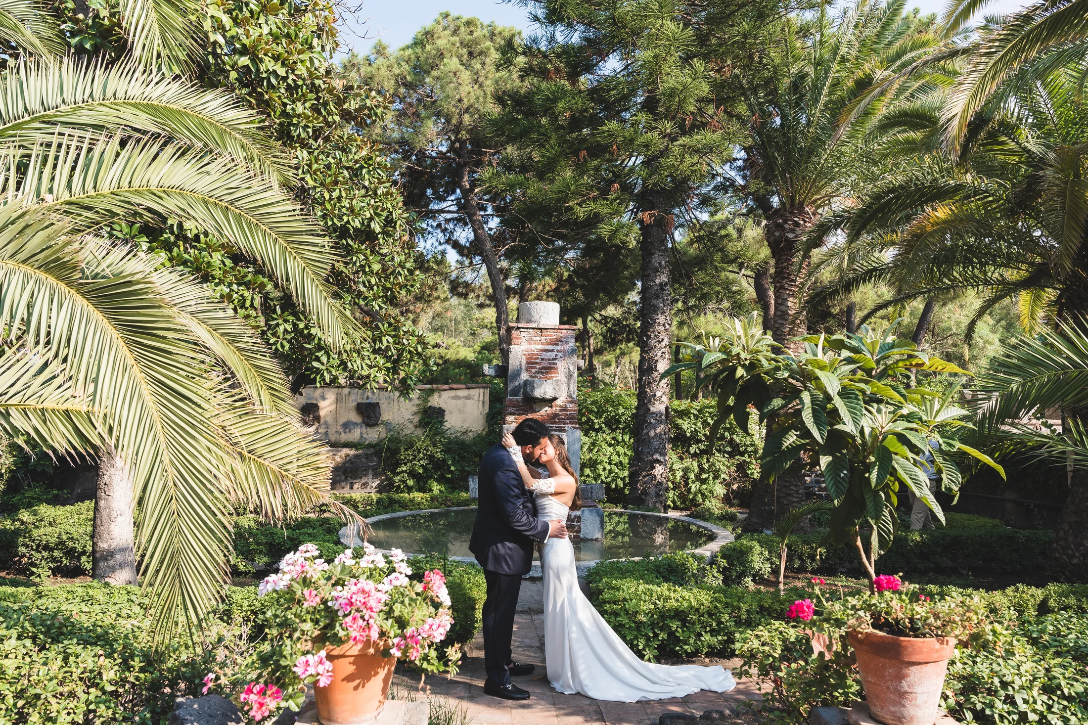 Bride and groom among palm trees