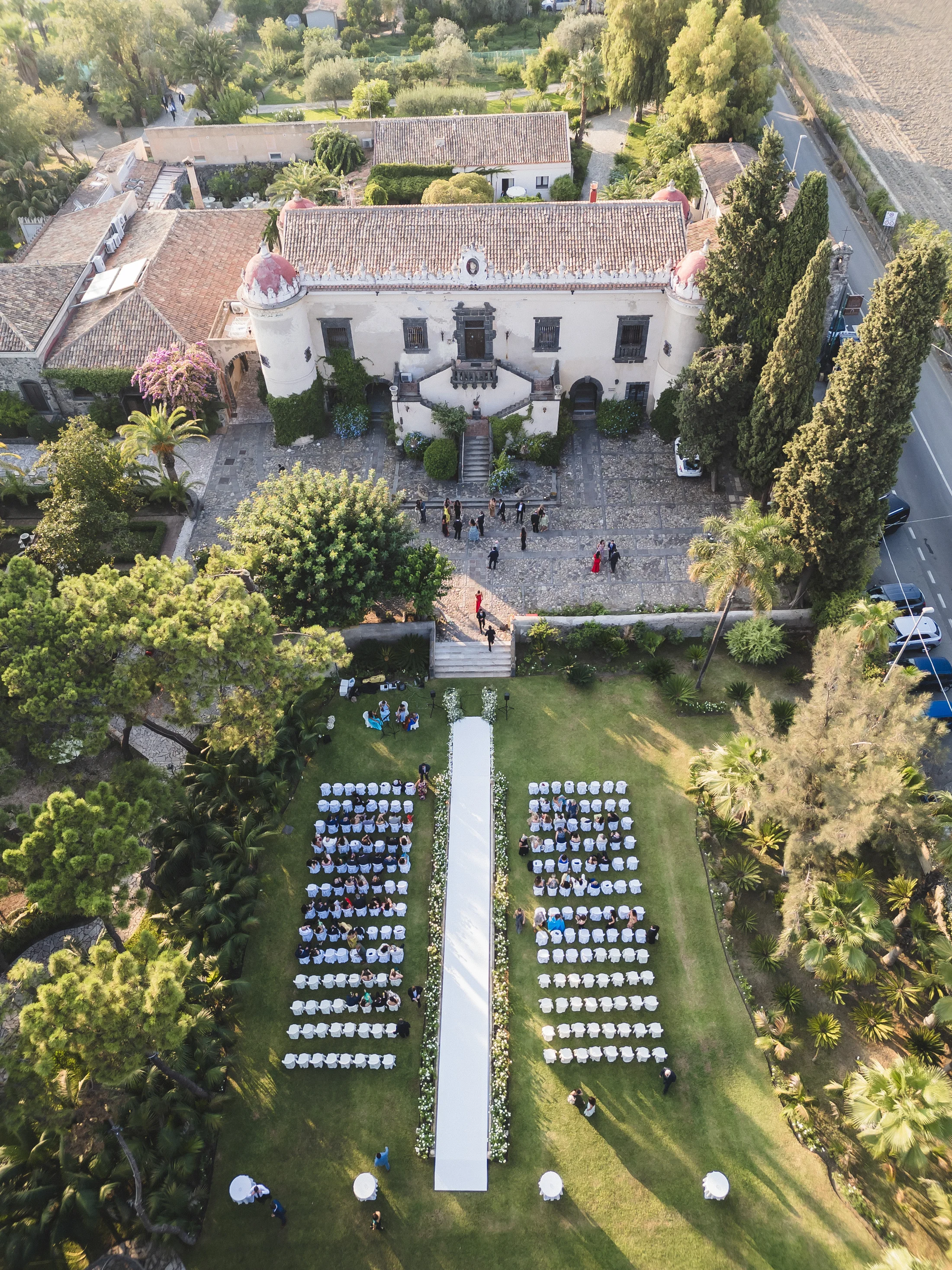 Aerial view of an outdoor ceremony at a villa