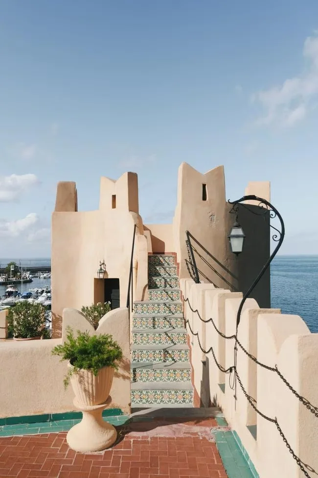 Castle terrace and staircase overlooking the sea