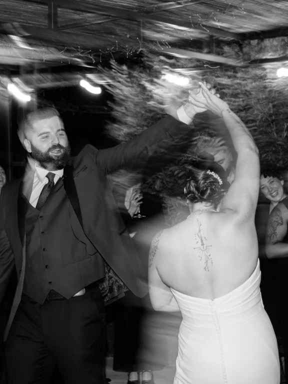 Black-and-white photograph of the bride on the dance floor