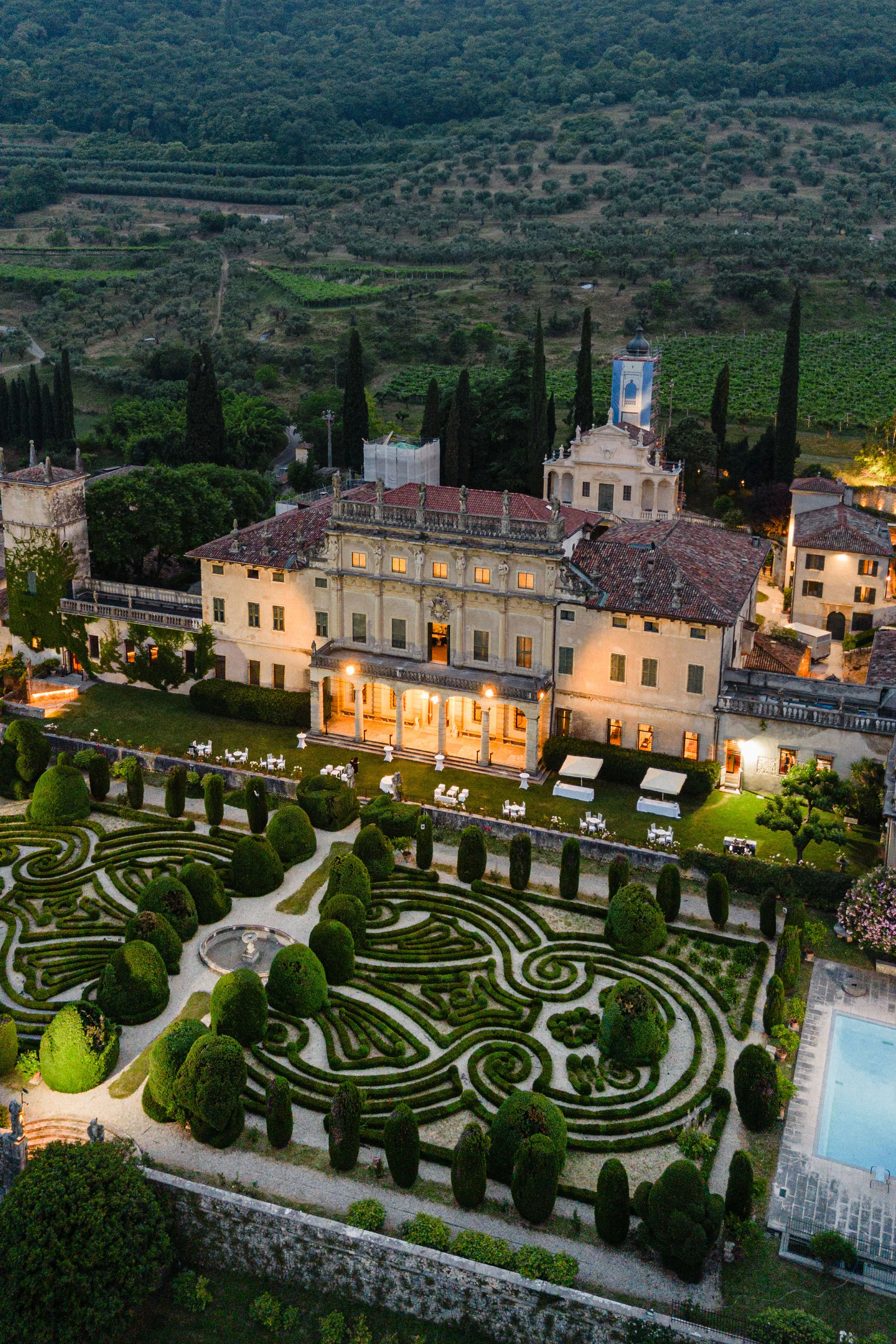 Aerial view of a villa and garden in evening light
