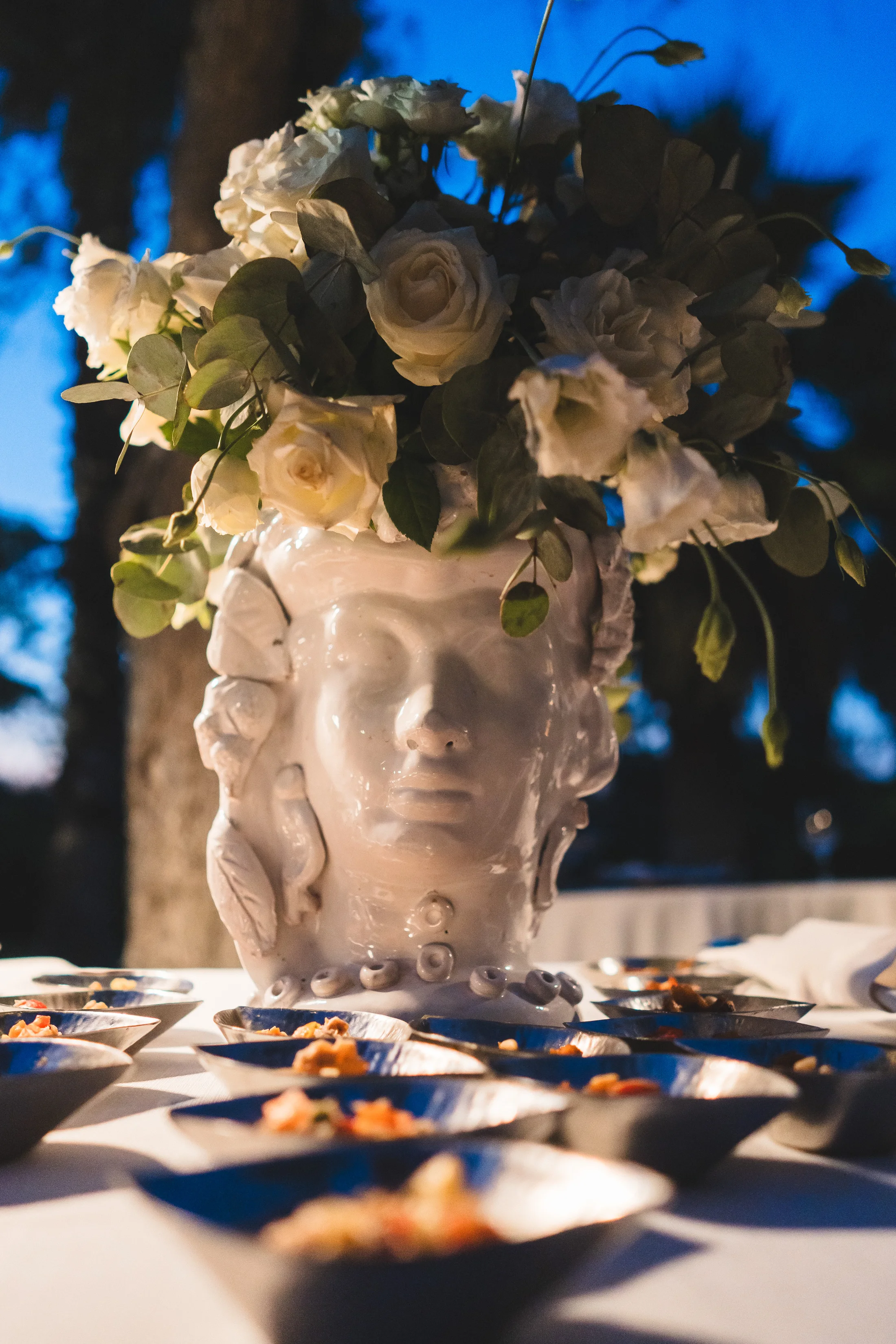 Flowers arranged in a sculpted head vase