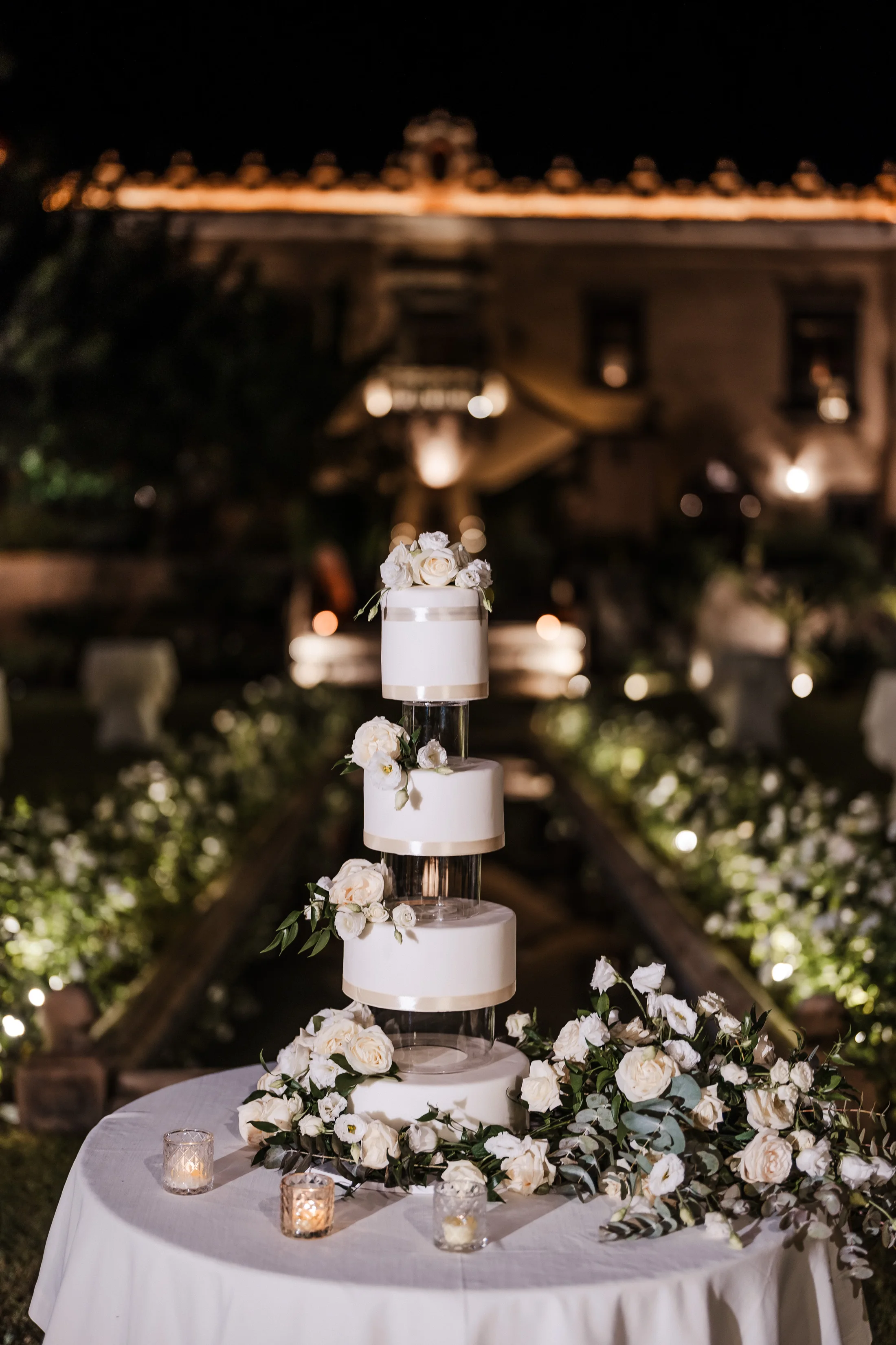 Wedding cake lit in a garden at night