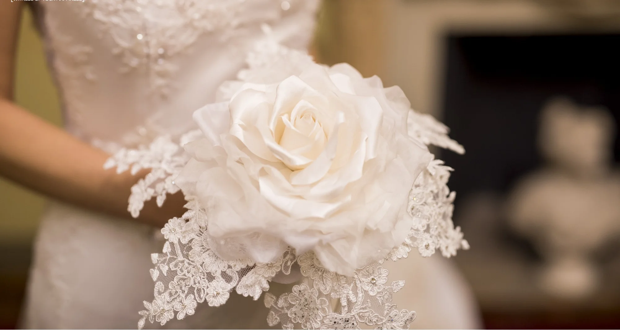 Close detail of a white floral bridal accessory