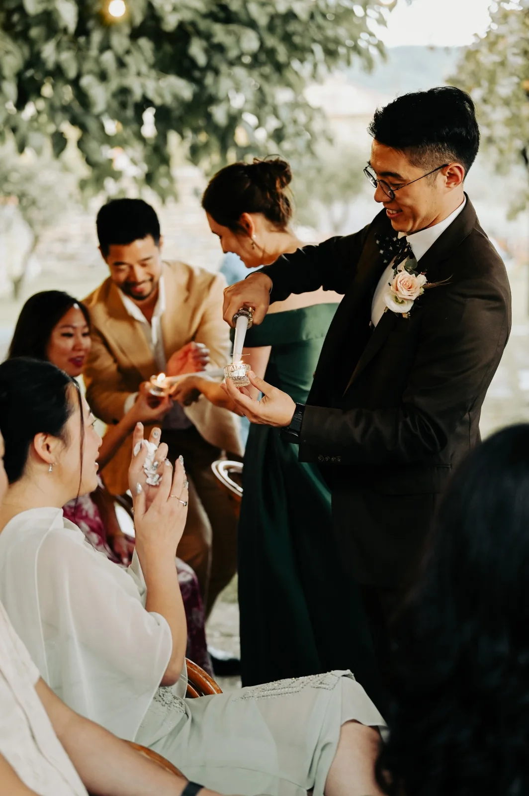 Guests taking part in an outdoor ceremony