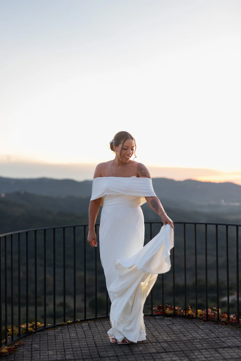 Bride on a terrace at sunset