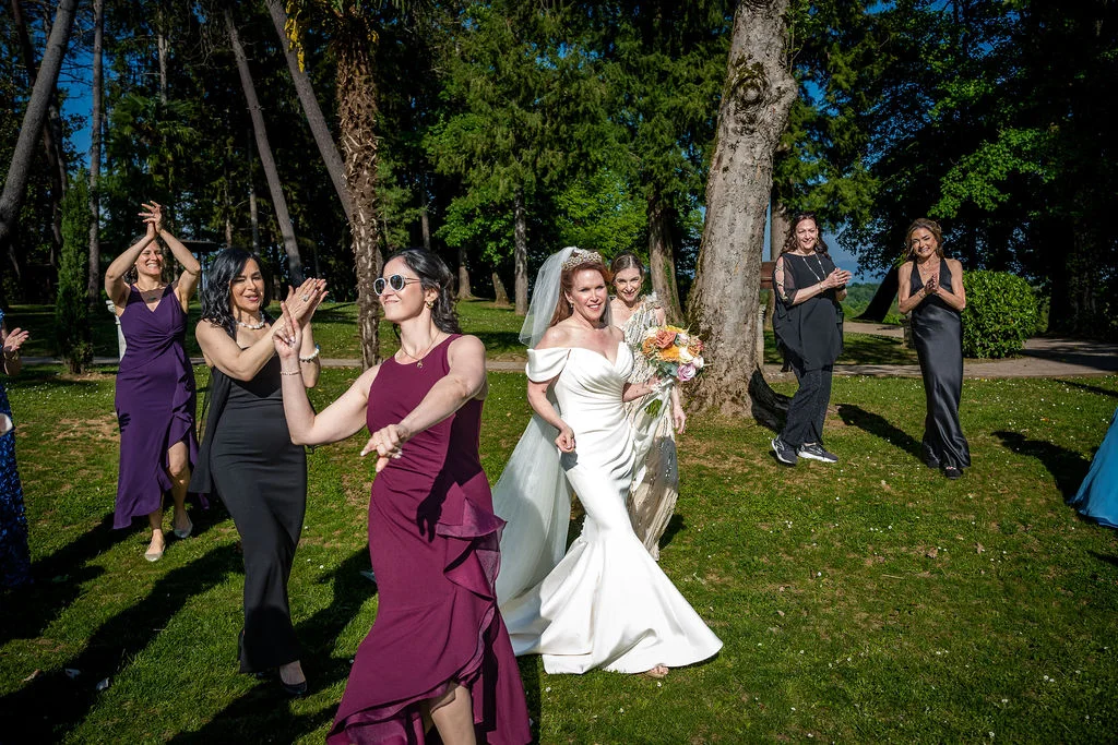 Bride celebrating with guests in a garden