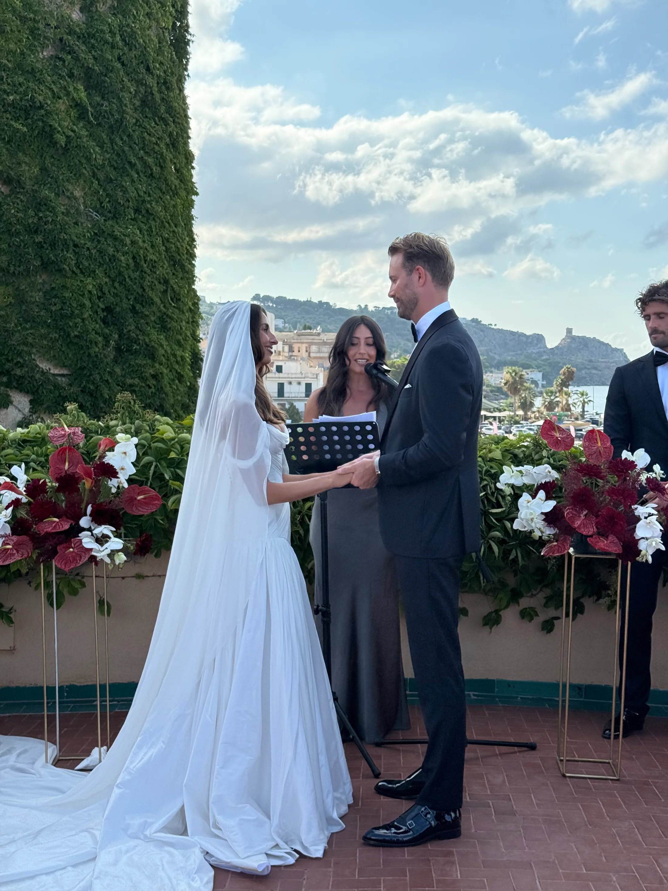 Bride and groom exchanging vows outdoors