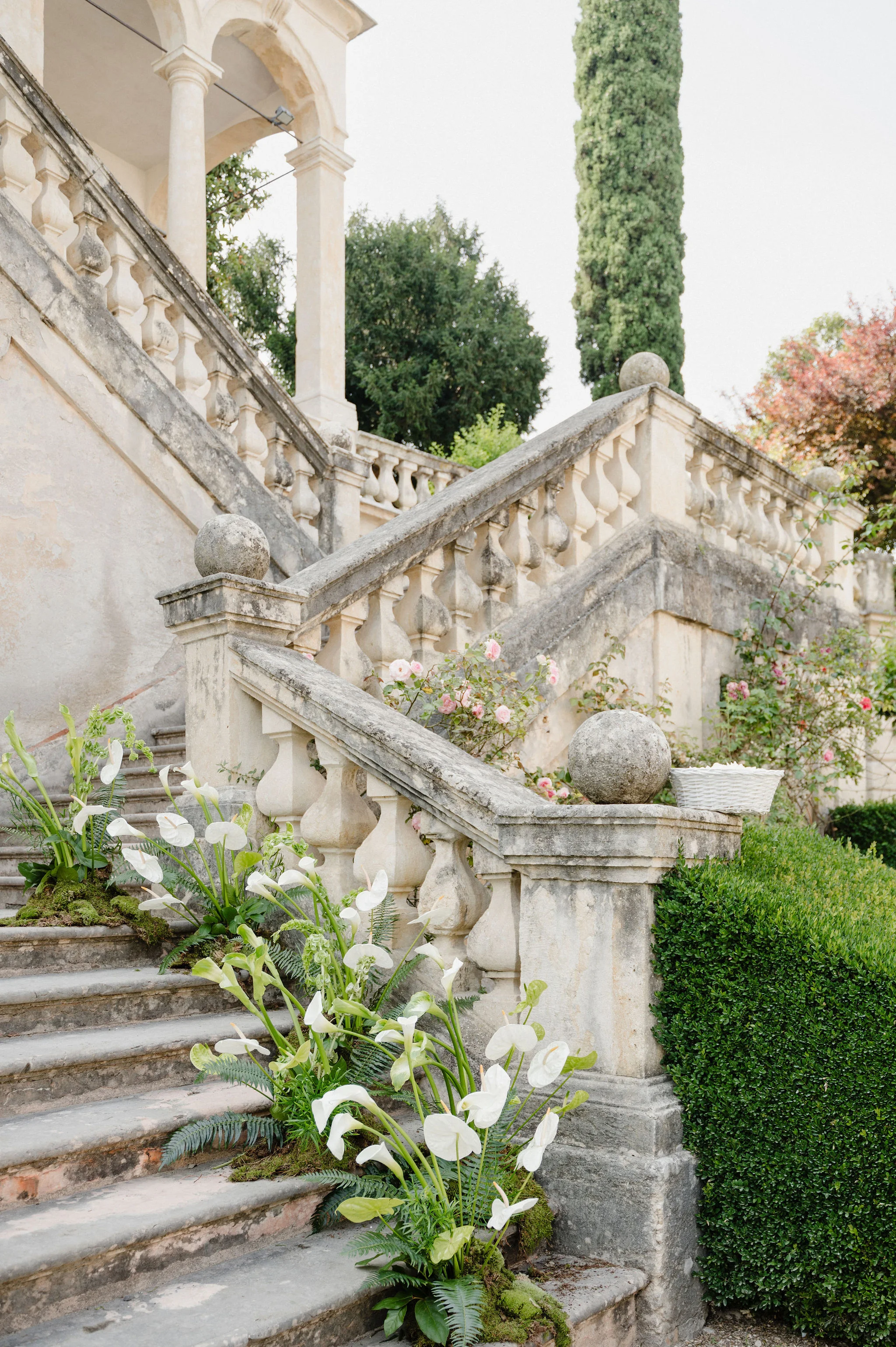 Stone staircase decorated with white flowers