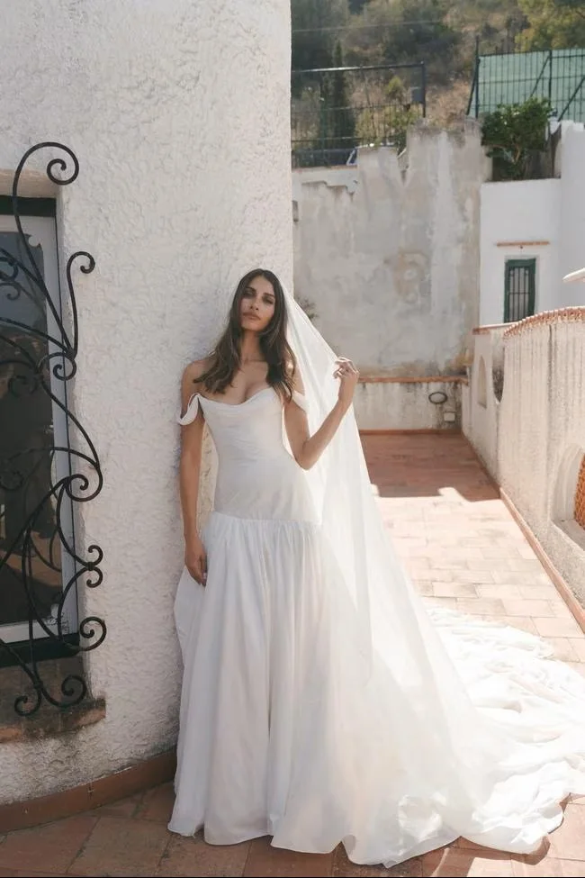 Bride at a doorway framed by climbing plants