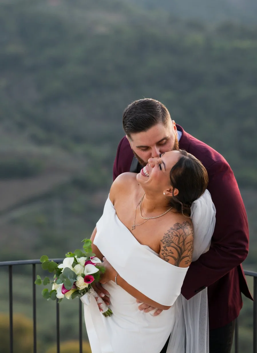 Bride and groom embracing outdoors
