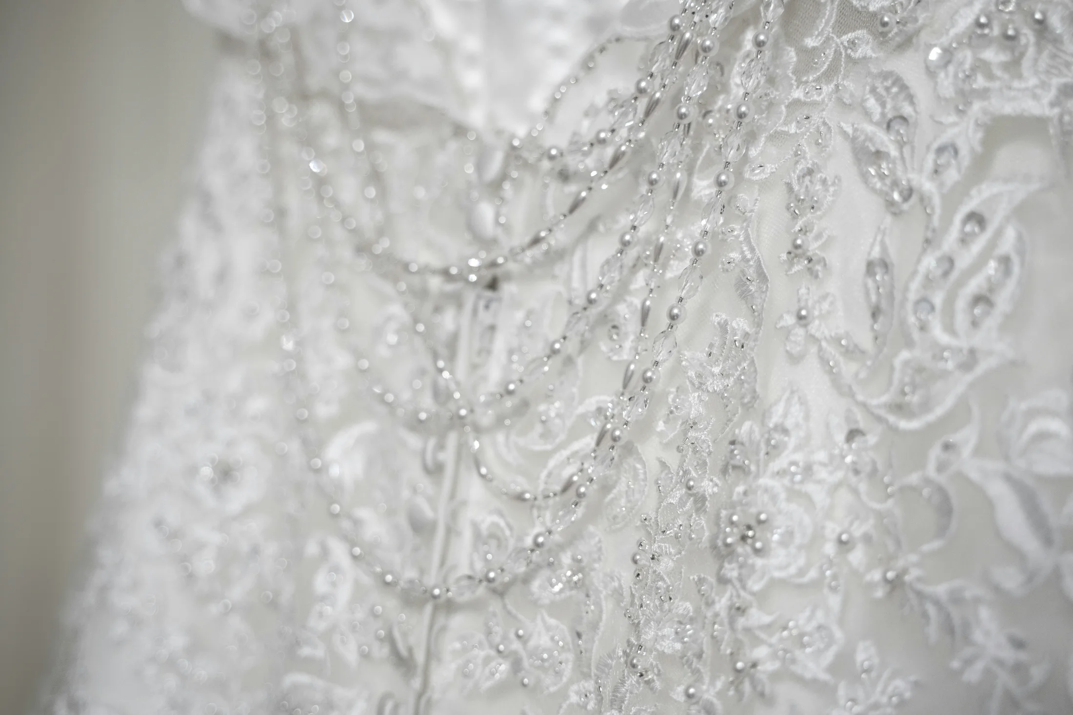 Beaded lace detail on a wedding dress