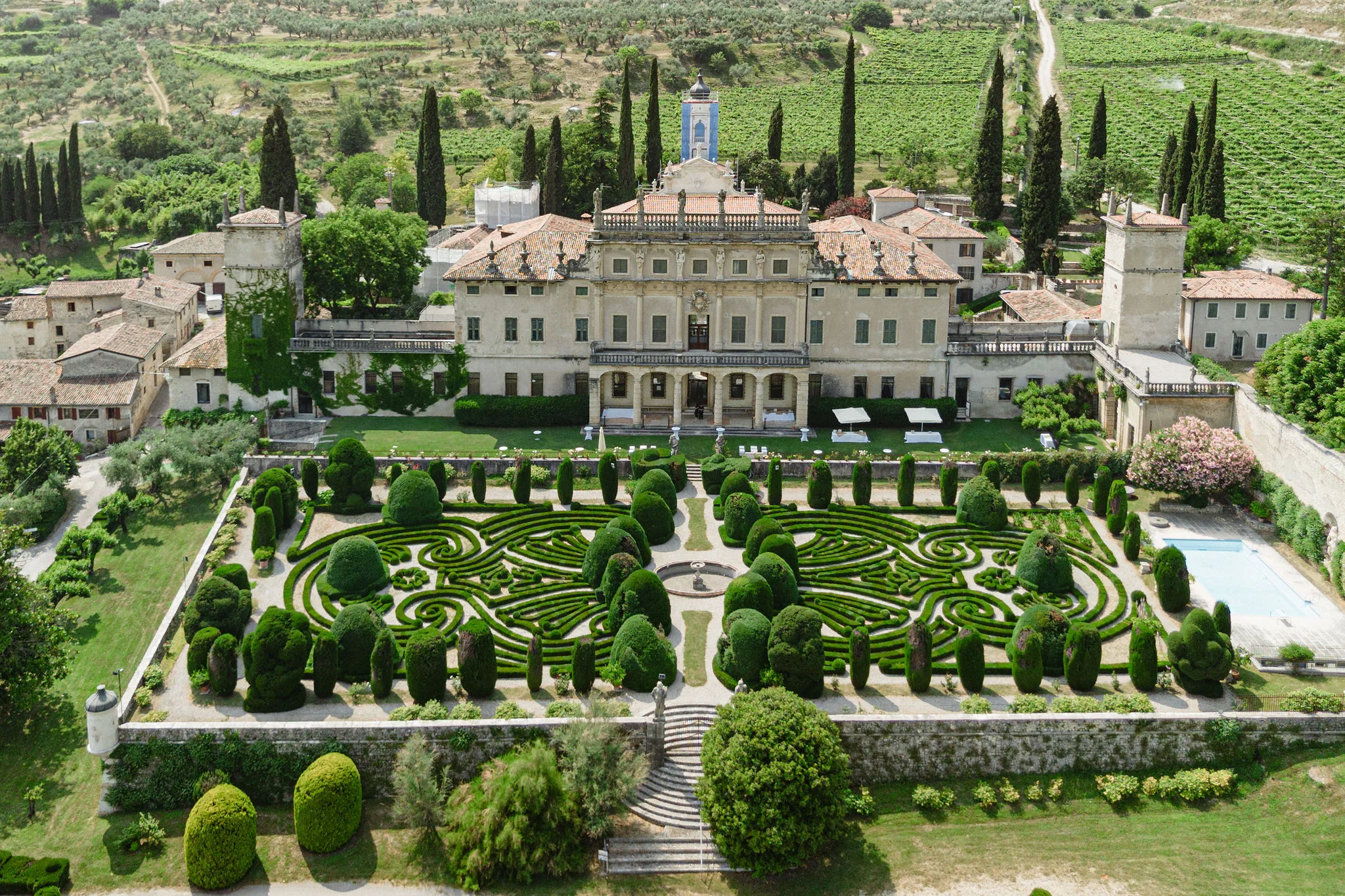 Aerial view of a villa and its formal gardens